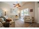 Comfortable living room offers a relaxing space with a ceiling fan and sliding doors to the backyard at 3873 Hampton Hills Dr, Lakeland, FL 33810