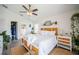 Spacious main bedroom featuring neutral decor, laminate flooring, and an ensuite bath at 3873 Hampton Hills Dr, Lakeland, FL 33810