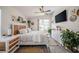 Serene main bedroom featuring neutral decor, ample natural light, and backyard views at 3873 Hampton Hills Dr, Lakeland, FL 33810