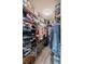 A fully organized walk-in closet with shelving and hanging rods for clothing and accessories at 3873 Hampton Hills Dr, Lakeland, FL 33810