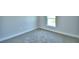 Bright bedroom with soft carpeting, a window for natural light, and ample space at 4019 Tullamore Ln, Auburndale, FL 33823