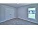 Bedroom with plush carpeting and a window view at 4019 Tullamore Ln, Auburndale, FL 33823