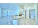 Kitchen island featuring granite countertops and stainless steel dishwasher at 4019 Tullamore Ln, Auburndale, FL 33823