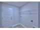 Laundry room with tile flooring and wire shelving at 4019 Tullamore Ln, Auburndale, FL 33823