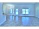 Expansive living area features neutral tones, tile flooring and large windows at 4019 Tullamore Ln, Auburndale, FL 33823