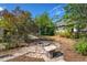 Backyard featuring a circular brick firepit area and a screened-in pool, perfect for outdoor relaxation and entertainment at 402 W Patterson St, Lakeland, FL 33803