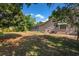 The backyard features mature trees, screened in porch, and is spacious at 402 W Patterson St, Lakeland, FL 33803