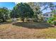 The large backyard offers plenty of space and features mature trees providing shade and a peaceful setting at 402 W Patterson St, Lakeland, FL 33803