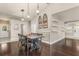 Inviting dining area featuring a wooden table, stylish lighting, and access to multiple rooms at 402 W Patterson St, Lakeland, FL 33803