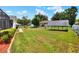 A spacious backyard offers ample green space, providing room for recreation and relaxation at 404 Willow Run, Lakeland, FL 33813