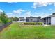 Expansive backyard featuring a screened-in pool, perfect for outdoor relaxation and entertaining at 404 Willow Run, Lakeland, FL 33813