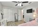 Comfortable bedroom offering a ceiling fan, closet, and a study area at 404 Willow Run, Lakeland, FL 33813