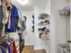 Walk-in closet with ample storage and custom shelving units at 404 Willow Run, Lakeland, FL 33813