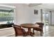 Cozy dining area with bright windows and a wooden table at 404 Willow Run, Lakeland, FL 33813