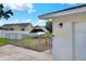 Side view of the home. The home has a well maintained yard and covered area at 404 Willow Run, Lakeland, FL 33813