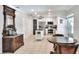Well-equipped kitchen features white cabinetry, stainless steel appliances, and a center island for cooking at 404 Willow Run, Lakeland, FL 33813