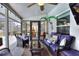 A screened patio features furniture, decor, and a view of the backyard pool at 404 Willow Run, Lakeland, FL 33813