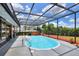 Charming screened pool area with spa for year-round enjoyment and outdoor fun at 404 Willow Run, Lakeland, FL 33813