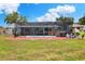 Beautiful backyard with screened pool area, hot tub, and well-maintained landscaping at 404 Willow Run, Lakeland, FL 33813