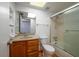 Well-lit bathroom with a classic single vanity, shower and tub combo at 409 San Jose Dr, Winter Haven, FL 33884