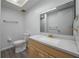 Bright bathroom with a single vanity with granite counter and tile flooring at 409 San Jose Dr, Winter Haven, FL 33884