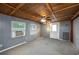 Spacious garage with gray walls, wood ceiling, and window air conditioner at 409 San Jose Dr, Winter Haven, FL 33884