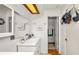 Bright bathroom featuring a modern vanity, decorative mirror, and recessed lighting at 417 Yolonda Ct, Lakeland, FL 33809