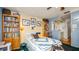 The bedroom has a queen bed and book shelves for storage at 417 Yolonda Ct, Lakeland, FL 33809