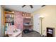 Comfortable bedroom featuring a reading nook with a bookshelf at 417 Yolonda Ct, Lakeland, FL 33809