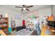 Bedroom featuring a ceiling fan and a cat tower near the window at 417 Yolonda Ct, Lakeland, FL 33809