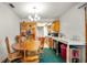 The dining room features a wooden table, hutch and a view of the kitchen at 417 Yolonda Ct, Lakeland, FL 33809