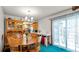 Cozy dining area with wooden furniture and view to the kitchen at 417 Yolonda Ct, Lakeland, FL 33809