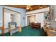 Inviting living room featuring a wood ceiling, a decorative loft, and a barn-style door at 417 Yolonda Ct, Lakeland, FL 33809