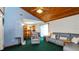 Open living room featuring a wood ceiling that offers a view into the adjacent kitchen and dining area at 417 Yolonda Ct, Lakeland, FL 33809