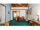 Inviting living room featuring a wood ceiling, a decorative loft, and a barn-style door at 417 Yolonda Ct, Lakeland, FL 33809
