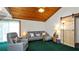 Comfortable living room featuring a wood ceiling and plush seating with a sliding barn door at 417 Yolonda Ct, Lakeland, FL 33809