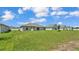 Expansive backyard with green grass, backing to other homes, providing plenty of space for activities at 4582 Penkert Pl, Lakeland, FL 33811