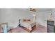 Cozy bedroom with ceiling fan and access to ensuite bathroom at 4582 Penkert Pl, Lakeland, FL 33811
