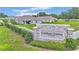 Entrance to Gresham Farms Village features stone signage and manicured landscaping at 4582 Penkert Pl, Lakeland, FL 33811