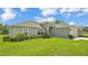 Charming single-story home featuring a well-manicured lawn, neutral paint, and a two-car garage at 4582 Penkert Pl, Lakeland, FL 33811