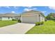 Attractive single-story home with a two-car garage and landscaped front yard at 4582 Penkert Pl, Lakeland, FL 33811