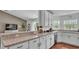 Open concept kitchen with breakfast bar and backyard view at 4582 Penkert Pl, Lakeland, FL 33811