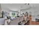 Spacious living room featuring stylish decor, hardwood floors and sliding door access to the backyard at 4582 Penkert Pl, Lakeland, FL 33811