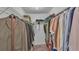 Spacious walk-in closet with shelving and ample hanging space for clothes and storage, for easy organization at 4582 Penkert Pl, Lakeland, FL 33811