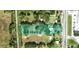 Aerial view of a property that features mature landscaping with a spacious lawn at 5211 Berkley Rd, Auburndale, FL 33823