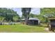 View of the backyard featuring a screened patio and swimming pool at 5211 Berkley Rd, Auburndale, FL 33823