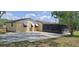 The back of the home offers an expansive concrete patio at 5211 Berkley Rd, Auburndale, FL 33823