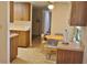 Kitchen with laminate floors and a breakfast table, offers a functional and inviting space for casual dining at 5211 Berkley Rd, Auburndale, FL 33823