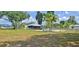 View of backyard and in-ground pool with patio area and full perimeter chain-link fence at 5211 Berkley Rd, Auburndale, FL 33823