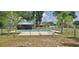 Backyard view showcasing the in-ground pool with surrounding patio and full fence enclosure at 5211 Berkley Rd, Auburndale, FL 33823